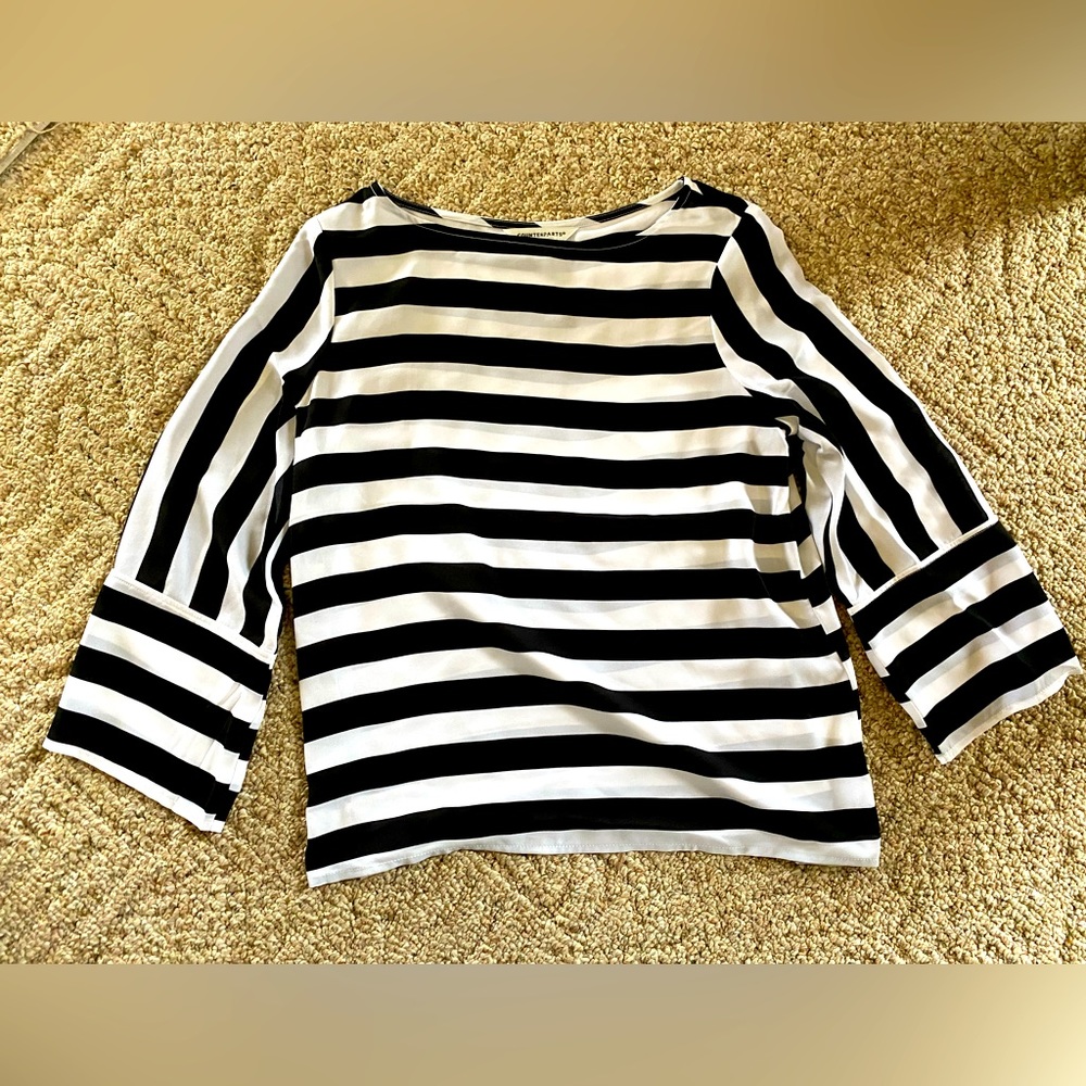 Counterparts black and white striped top.
